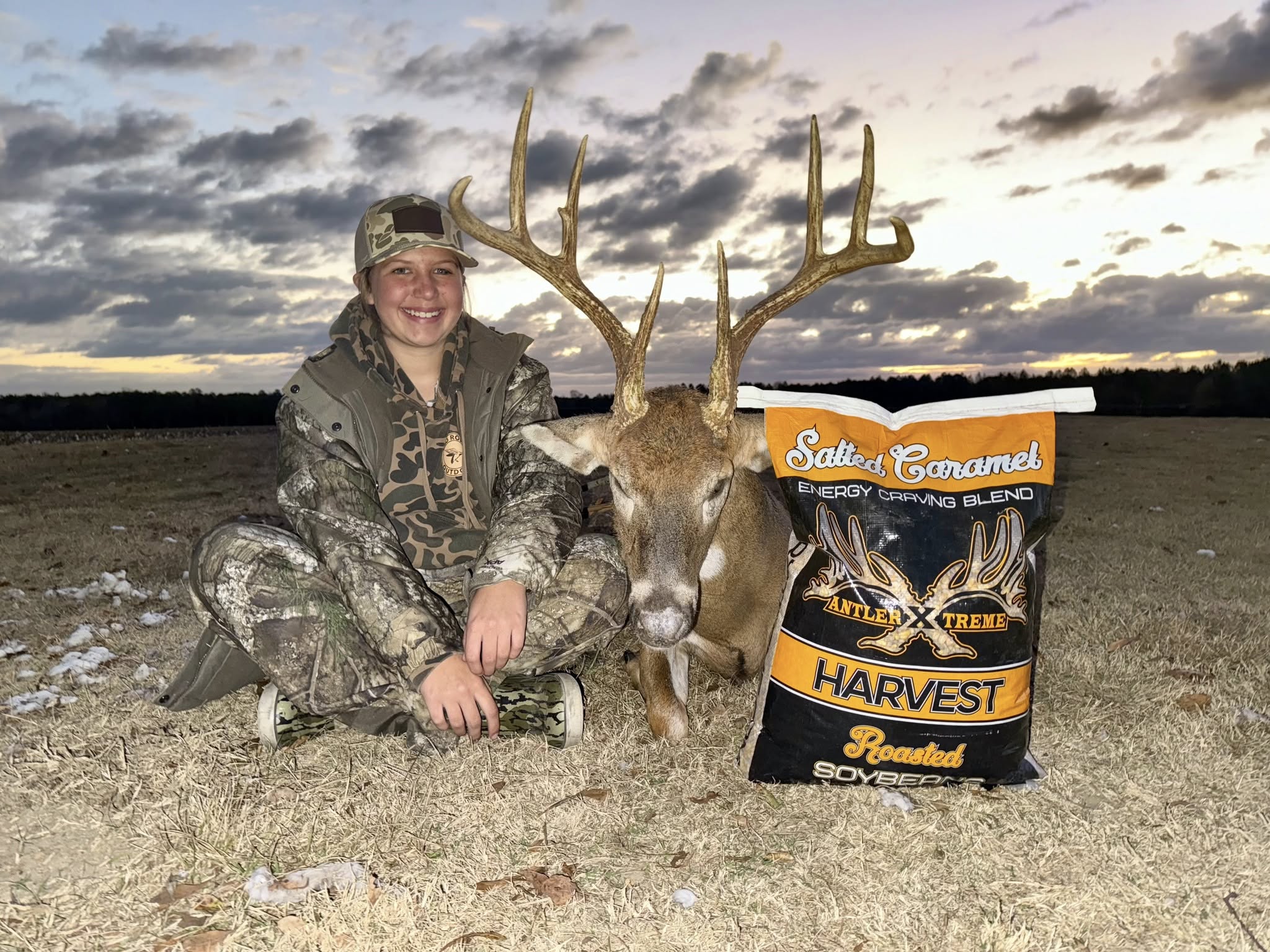 Scott and Kate Williams with whitetail deer harvested using AntlerXtreme feed in Georgia